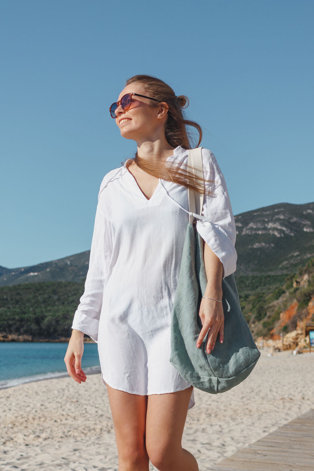 Woman wearing beach tote bags at the beach